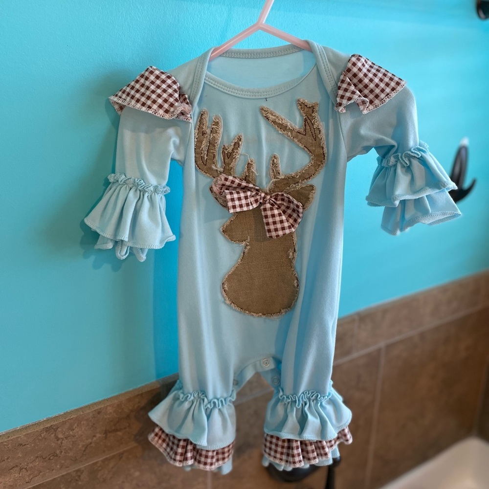 One piece outfit with ruffles cuffs on hands and feet with deer on front.